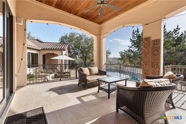 view of patio / terrace featuring an outdoor hangout area and a ceiling fan