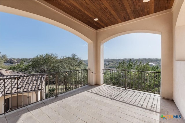 view of patio with a balcony