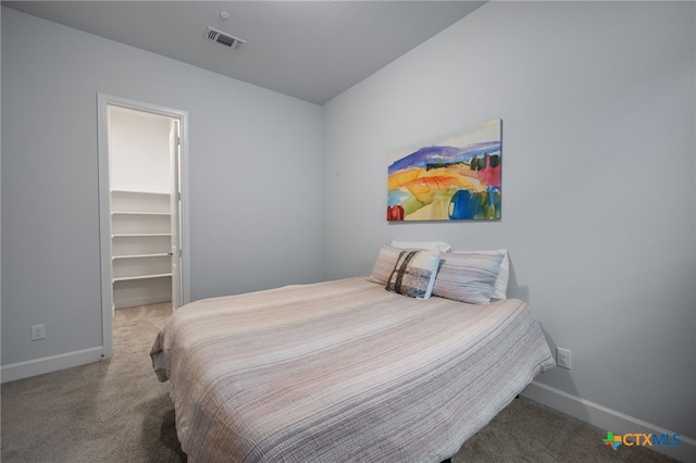 bedroom featuring carpet flooring, visible vents, and baseboards