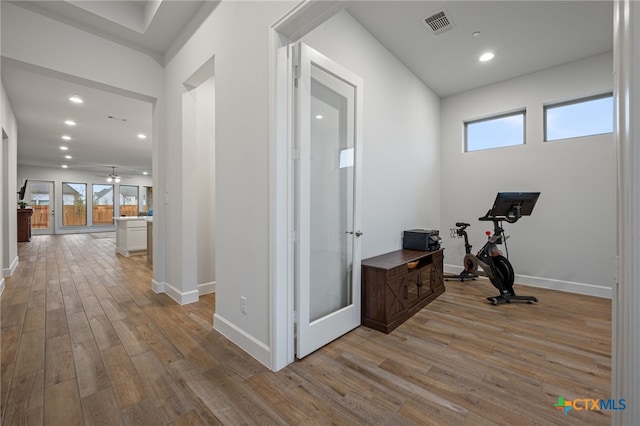 interior space featuring light wood finished floors, visible vents, and baseboards