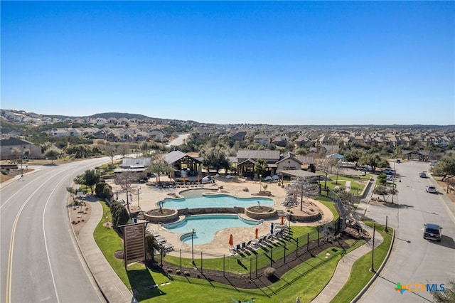 birds eye view of property with a mountain view