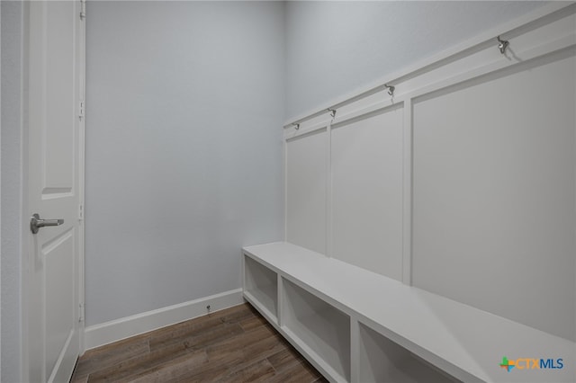 mudroom featuring dark wood-style floors and baseboards