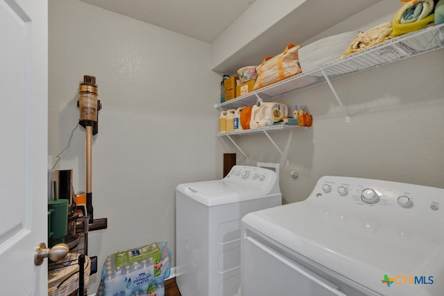 laundry area featuring washing machine and dryer