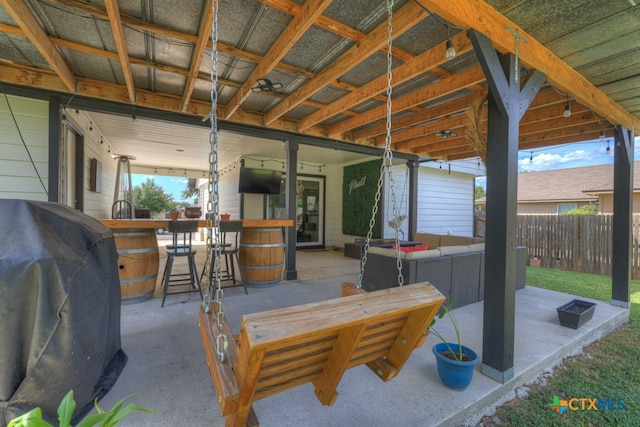 view of patio / terrace featuring a bar, a grill, and outdoor lounge area