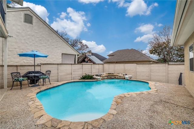 view of swimming pool with a patio area