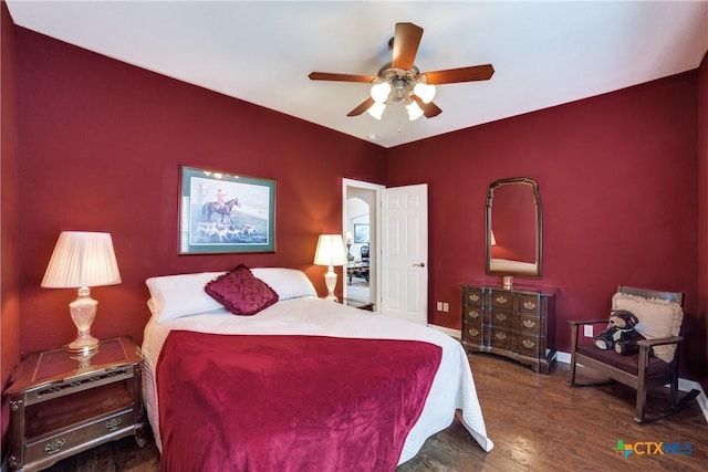 bedroom featuring dark hardwood / wood-style flooring and ceiling fan