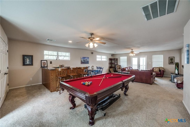 recreation room featuring french doors, billiards, bar area, ceiling fan, and carpet