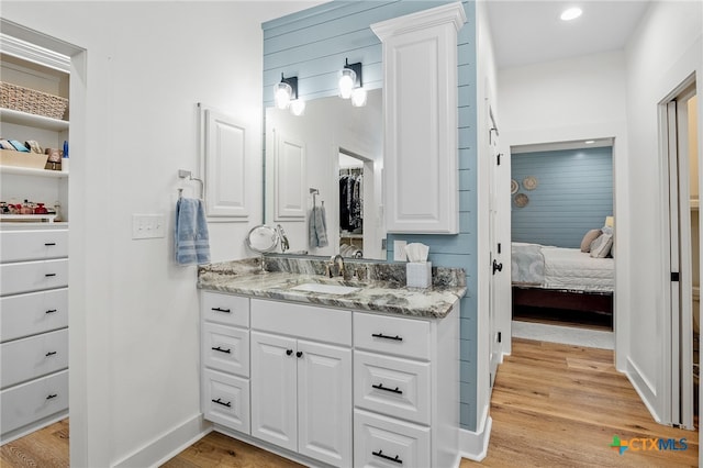 bathroom with vanity and hardwood / wood-style flooring