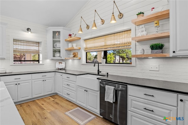 kitchen with a wealth of natural light, white cabinetry, and dishwasher