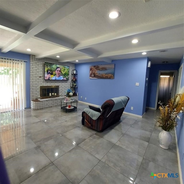 living room with a fireplace, coffered ceiling, a textured ceiling, and beam ceiling