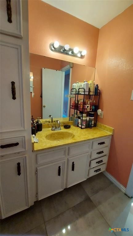 bathroom with vanity and tile patterned floors