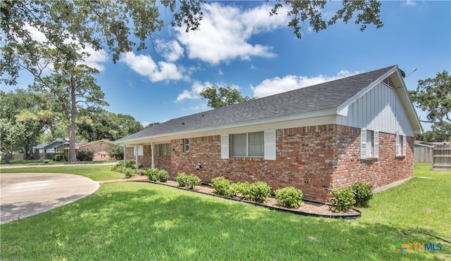 view of side of property featuring a yard