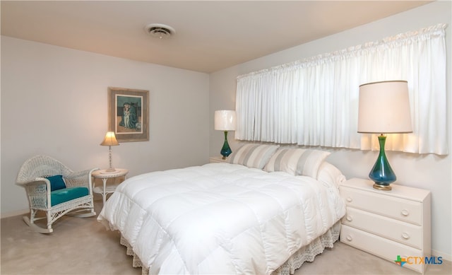 bedroom with light colored carpet