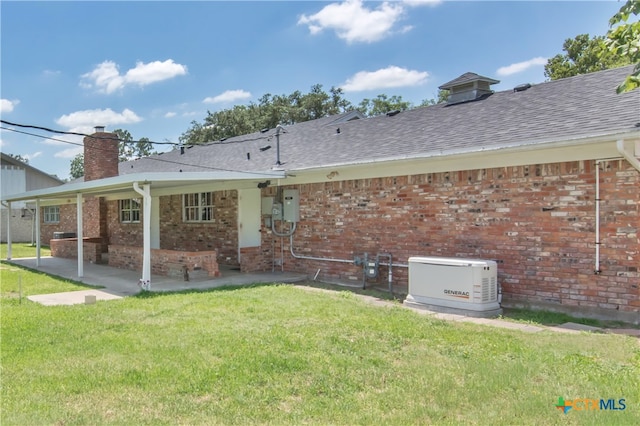 back of property featuring a patio area and a lawn