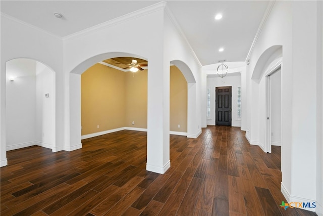 815 Lost Maples Trl, Georgetown, TX 78633 - foyer with arched walkways, dark wood-style floors, baseboards, ceiling fan, and ornamental molding
