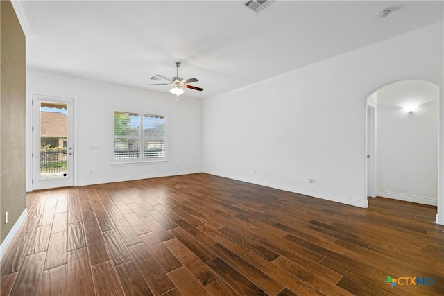 815 Lost Maples Trl, Georgetown, TX 78633 - spare room featuring ceiling fan, arched walkways, dark wood-style floors, and baseboards