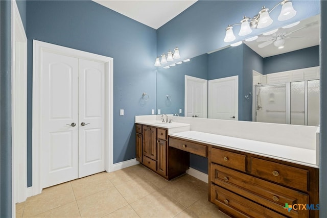 815 Lost Maples Trl, Georgetown, TX 78633 - full bath with a shower stall, ceiling fan, vanity, tile patterned flooring, and baseboards