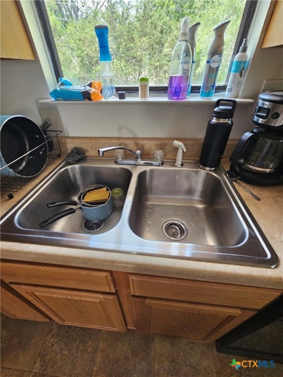 915 Dryden Ave, Copperas Cove, TX 76522 - kitchen view of brown cabinets and a sink