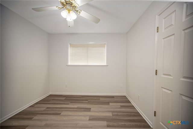 spare room featuring ceiling fan and wood-type flooring