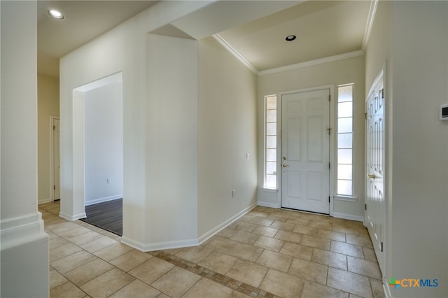 foyer featuring recessed lighting, baseboards, and ornamental molding