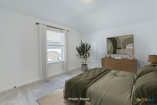 288 Smithsonian Ln, Kyle, TX 78640 - bedroom with vaulted ceiling, baseboards, and carpet floors