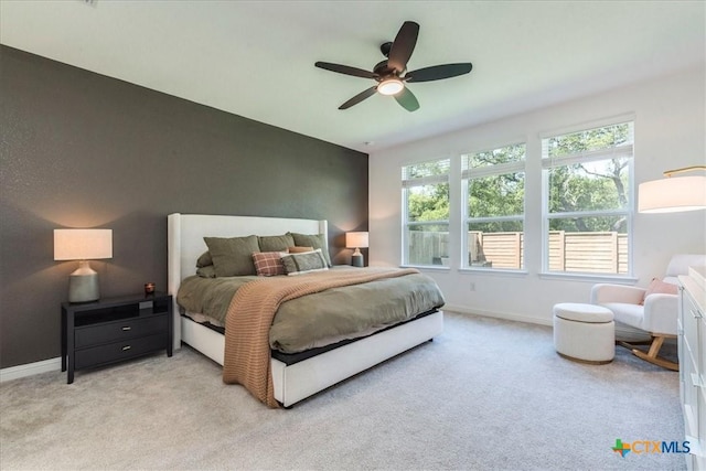 288 Smithsonian Ln, Kyle, TX 78640 - bedroom featuring light carpet, baseboards, and ceiling fan