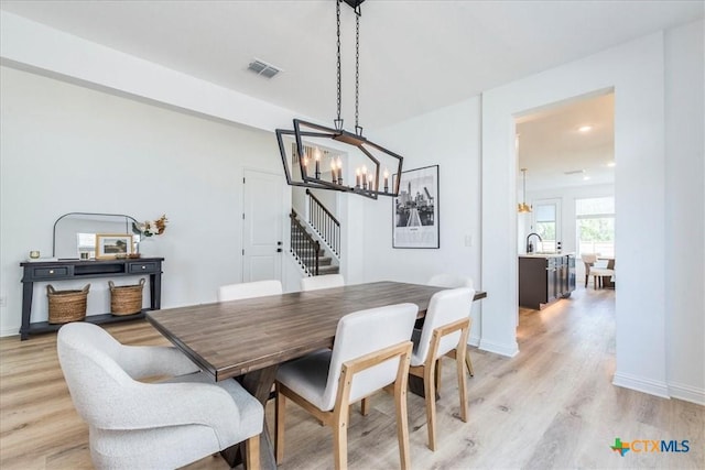 288 Smithsonian Ln, Kyle, TX 78640 - dining space featuring baseboards, recessed lighting, visible vents, light wood-style floors, and a chandelier