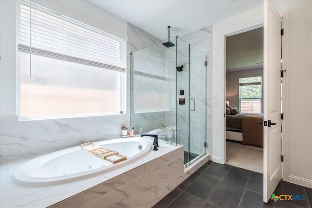 288 Smithsonian Ln, Kyle, TX 78640 - ensuite bathroom with tile patterned flooring, a garden tub, a marble finish shower, and connected bathroom