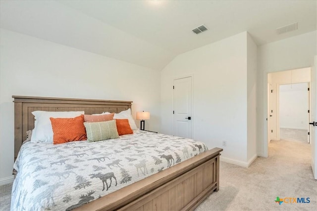 288 Smithsonian Ln, Kyle, TX 78640 - bedroom featuring light colored carpet, lofted ceiling, visible vents, and baseboards