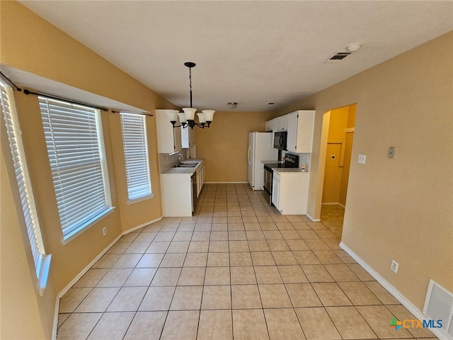 kitchen featuring light tile patterned flooring, sink, white cabinetry, a notable chandelier, and black appliances