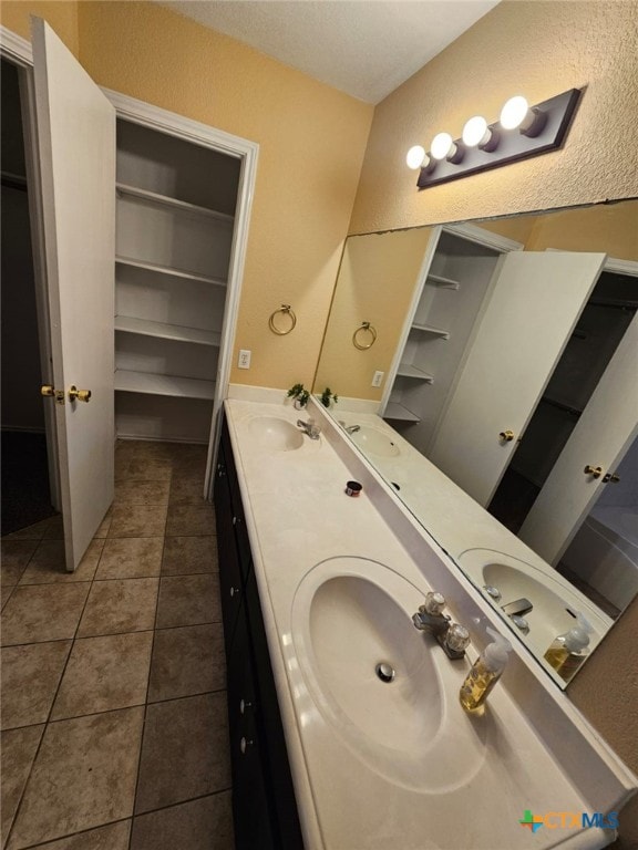 bathroom featuring tile patterned floors and vanity