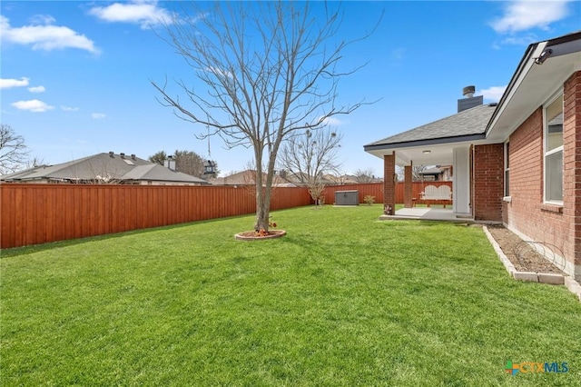 view of yard with a fenced backyard