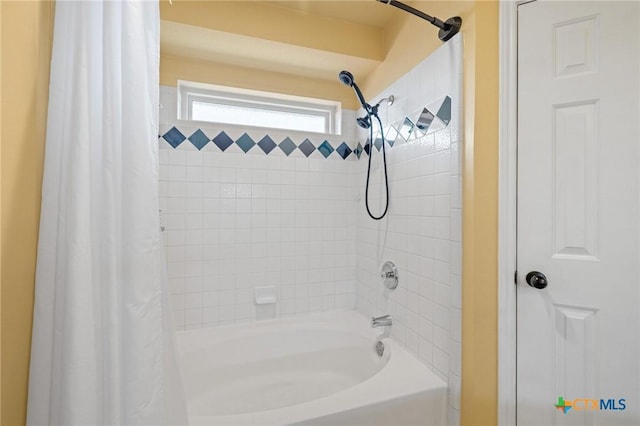 bathroom featuring shower / bathtub combination with curtain