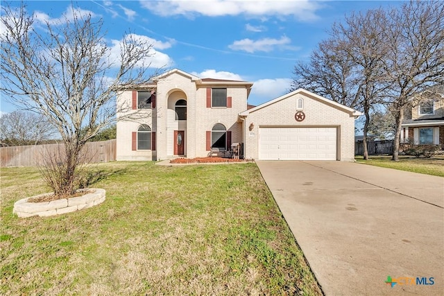 traditional-style home with an attached garage, brick siding, fence, concrete driveway, and a front yard