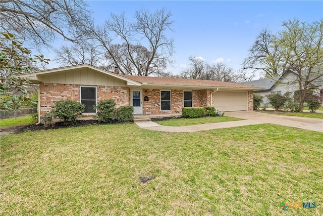 ranch-style home with a front yard, fence, driveway, a garage, and brick siding