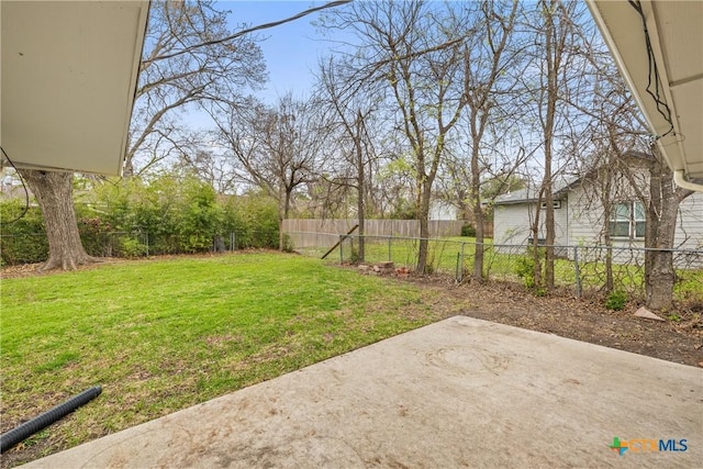 view of yard with a patio and fence