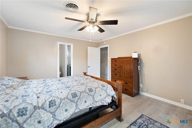 bedroom with ornamental molding, baseboards, visible vents, and light wood-type flooring