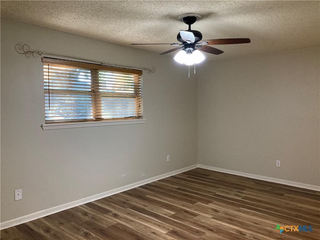 unfurnished room with ceiling fan, a textured ceiling, and dark wood-type flooring