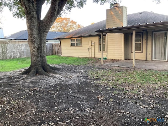 back of house with a patio area