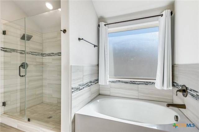 bathroom featuring plus walk in shower