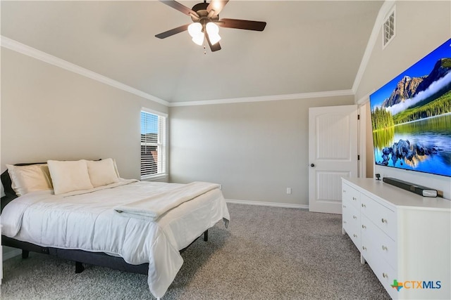 carpeted bedroom featuring ceiling fan, lofted ceiling, and ornamental molding