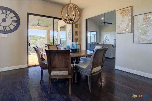 dining room featuring vaulted ceiling, dark wood-style flooring, an inviting chandelier, and baseboards