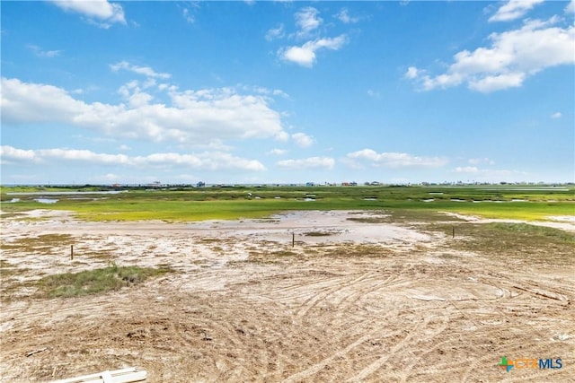 view of yard with a rural view