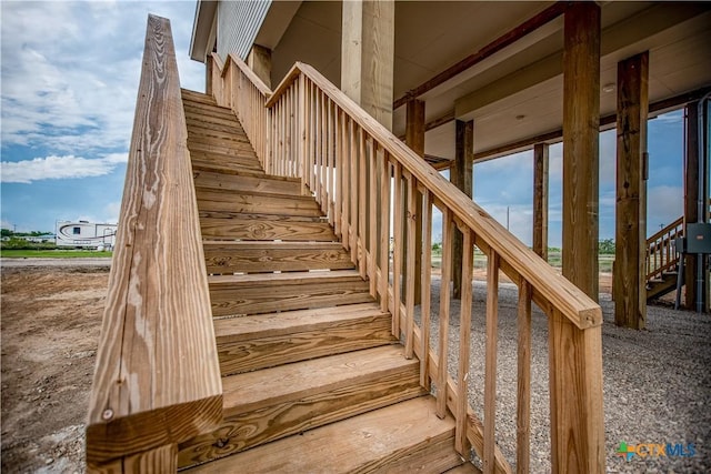 177 Powderhorn Ln, Port Lavaca, TX 77979 - back of property featuring stairs and a carport