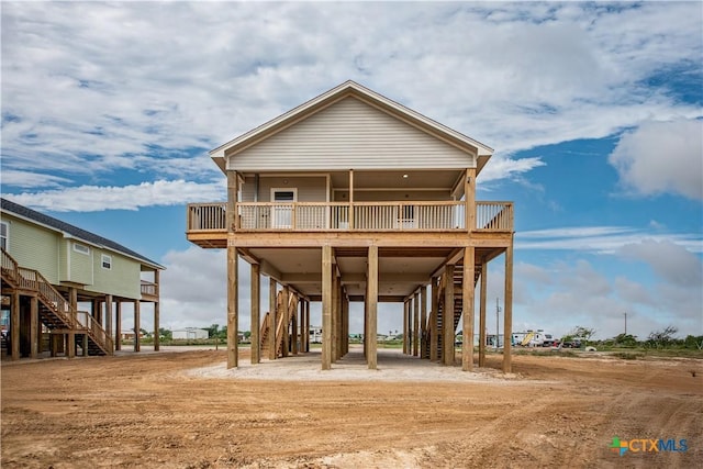 177 Powderhorn Ln, Port Lavaca, TX 77979 - back of property featuring stairs and a wooden deck