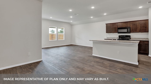 kitchen with black appliances, dark wood-type flooring, light stone counters, and a center island with sink