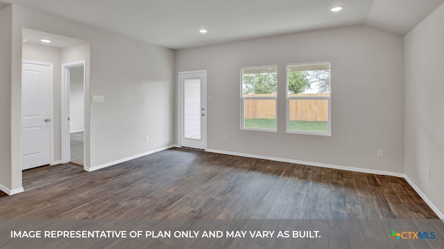 spare room with dark hardwood / wood-style flooring and lofted ceiling