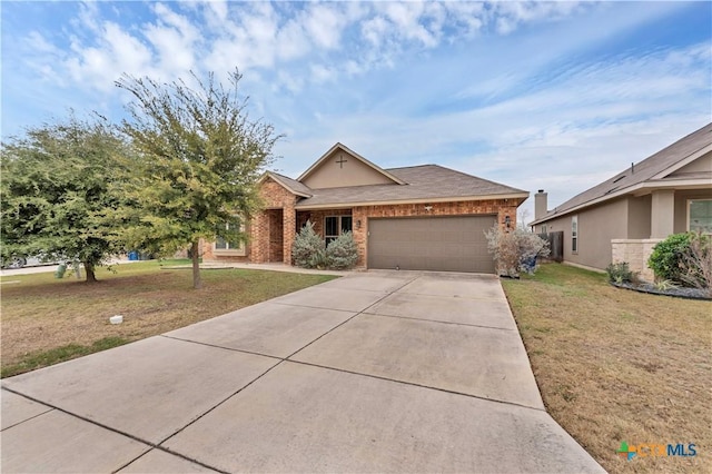 ranch-style house featuring a front yard and a garage