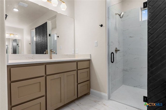 bathroom featuring vanity and an enclosed shower