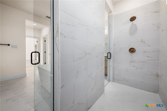 bathroom with a shower with shower door